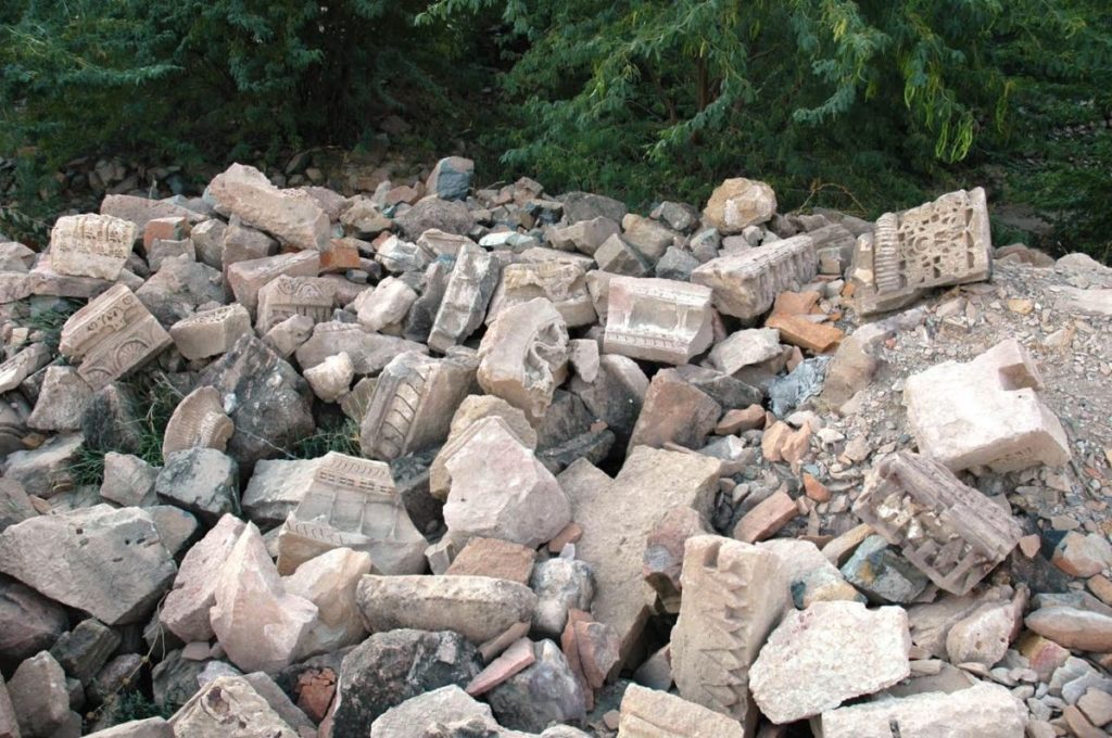 Stones from the ruins seen scattered and piled up at the temple complex.