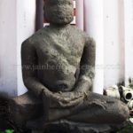 Ruined Tirthankar idol in padmasana - Jain Museum