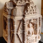Chaturmukha Jain Tirthankara idol with Tirthankara seated in Padmasana, 10th- 11th Century.