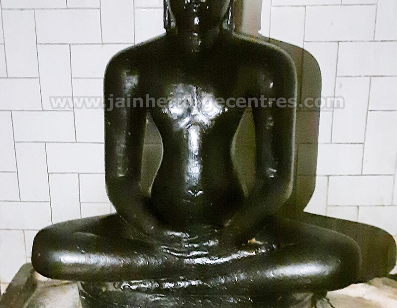 Ancient idol of Tirthankar Adinath in Paryankasana, 13th Century A.D., Sri Adinath Digambar Jain Temple, Muguru, Tirumakudalu Narasipura Taluk, Mysuru District, Karnataka, India.