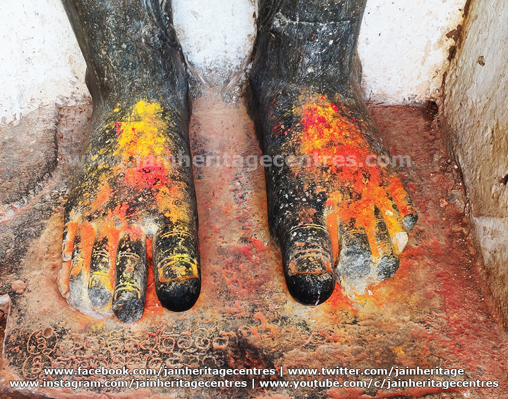 The feet of Bahubali stature with inscription.