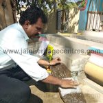 The Researcher R Shejeshwar taking an imprint of the inscription.