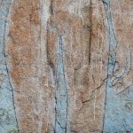 The carving of Parshwanath Tirthankara on a boulder